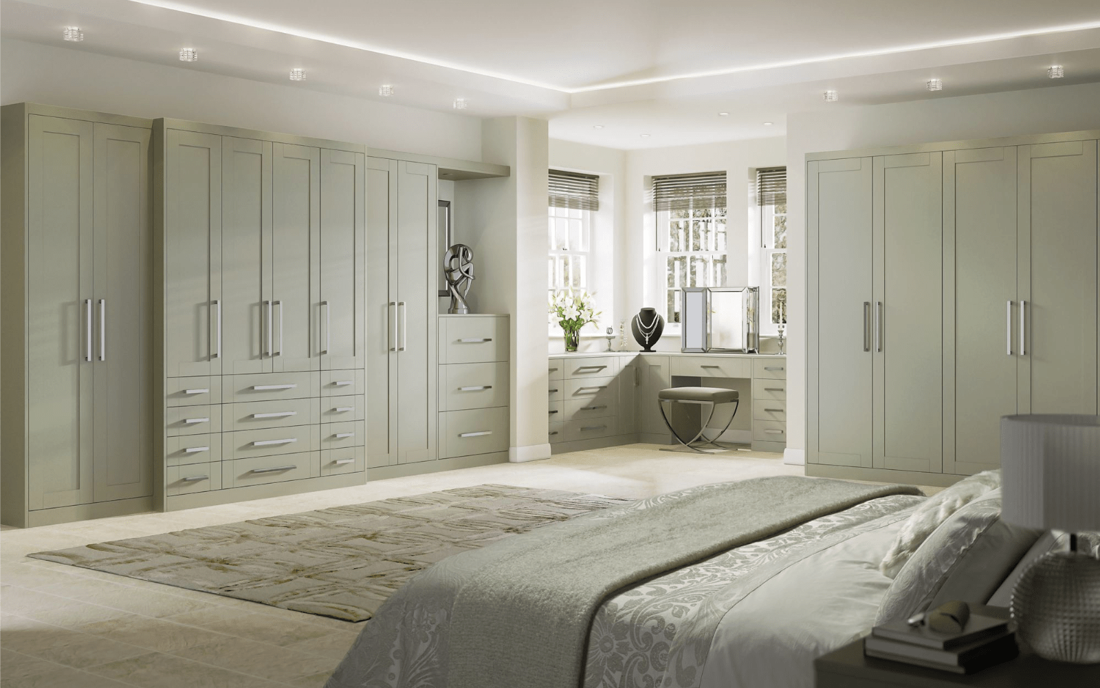 large bedroom with fitted cabinets and wardrobes