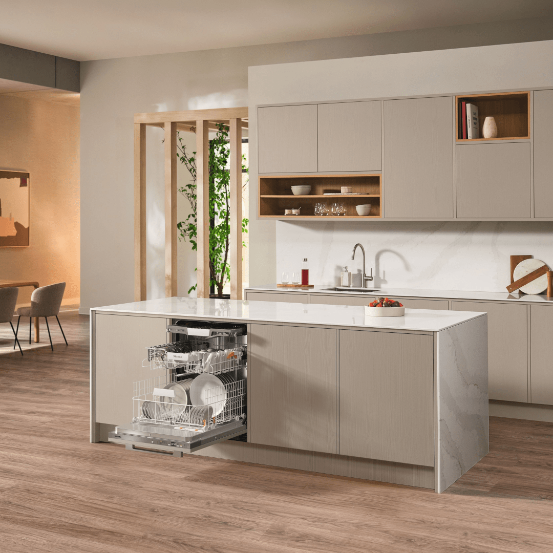 Bright modern kitchen with contemporary cupboards and hidden handles, showcasing a modern dishwasher blending into the kitchen